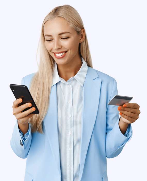 girl holding credit card and mobile